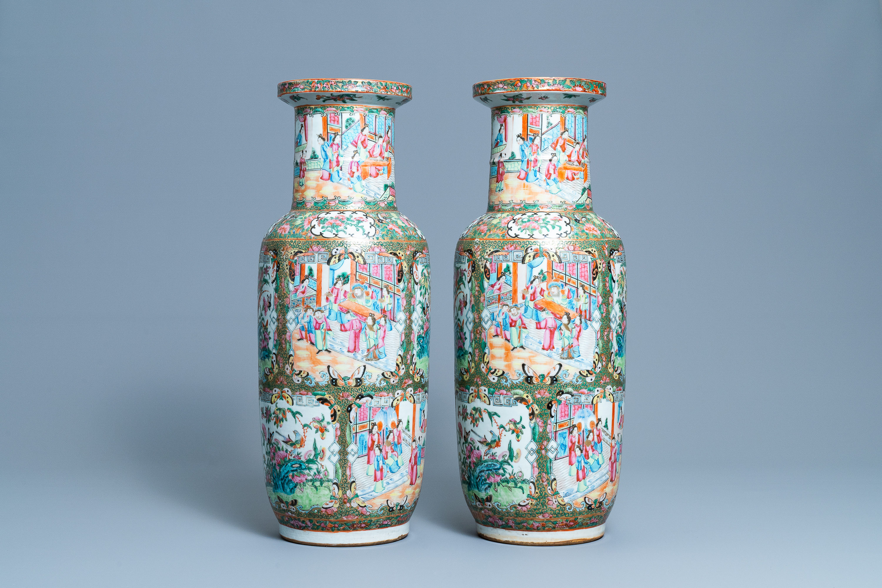 A pair of Chinese Canton famille rose rouleau vases, 19th C.