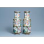 A pair of Chinese Canton famille rose rouleau vases, 19th C.