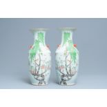 A pair of Chinese famille rose vases with birds among blossoming branches, 19/20th C.