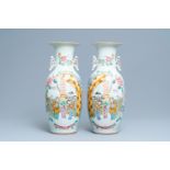 A pair of Chinese famille rose two-sided design vases, 19/20th C.