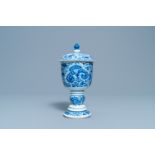 A Chinese blue and white beaker and cover with floral design, Kangxi