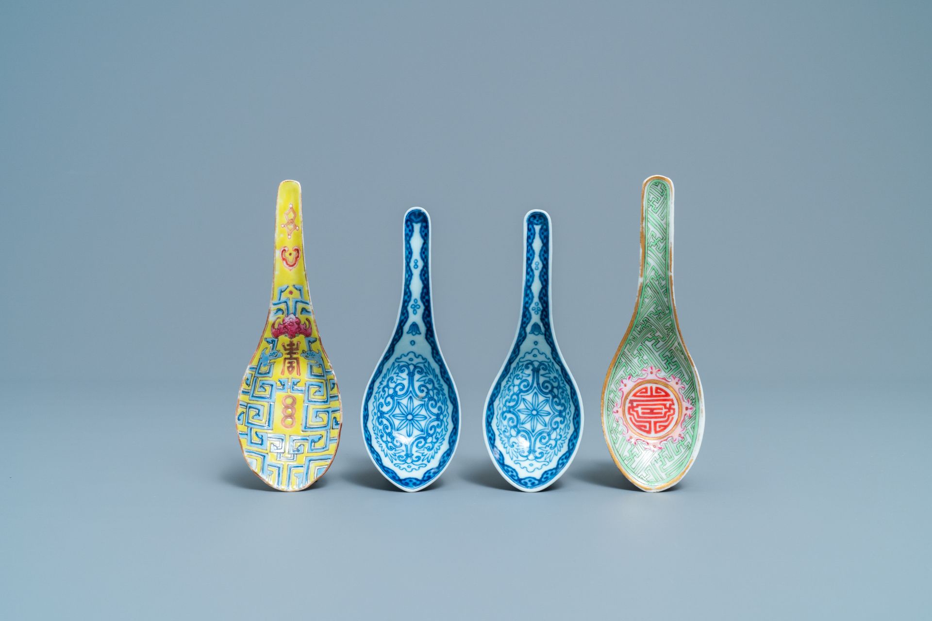 Four Chinese blue and white and famille rose spoons, 19th C.