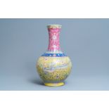 A large Chinese yellow-ground famille rose 'dragon and phoenix' bottle vase, 19th C.