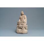 A Chinese carved stone group of Buddha on a throne, Wei or later