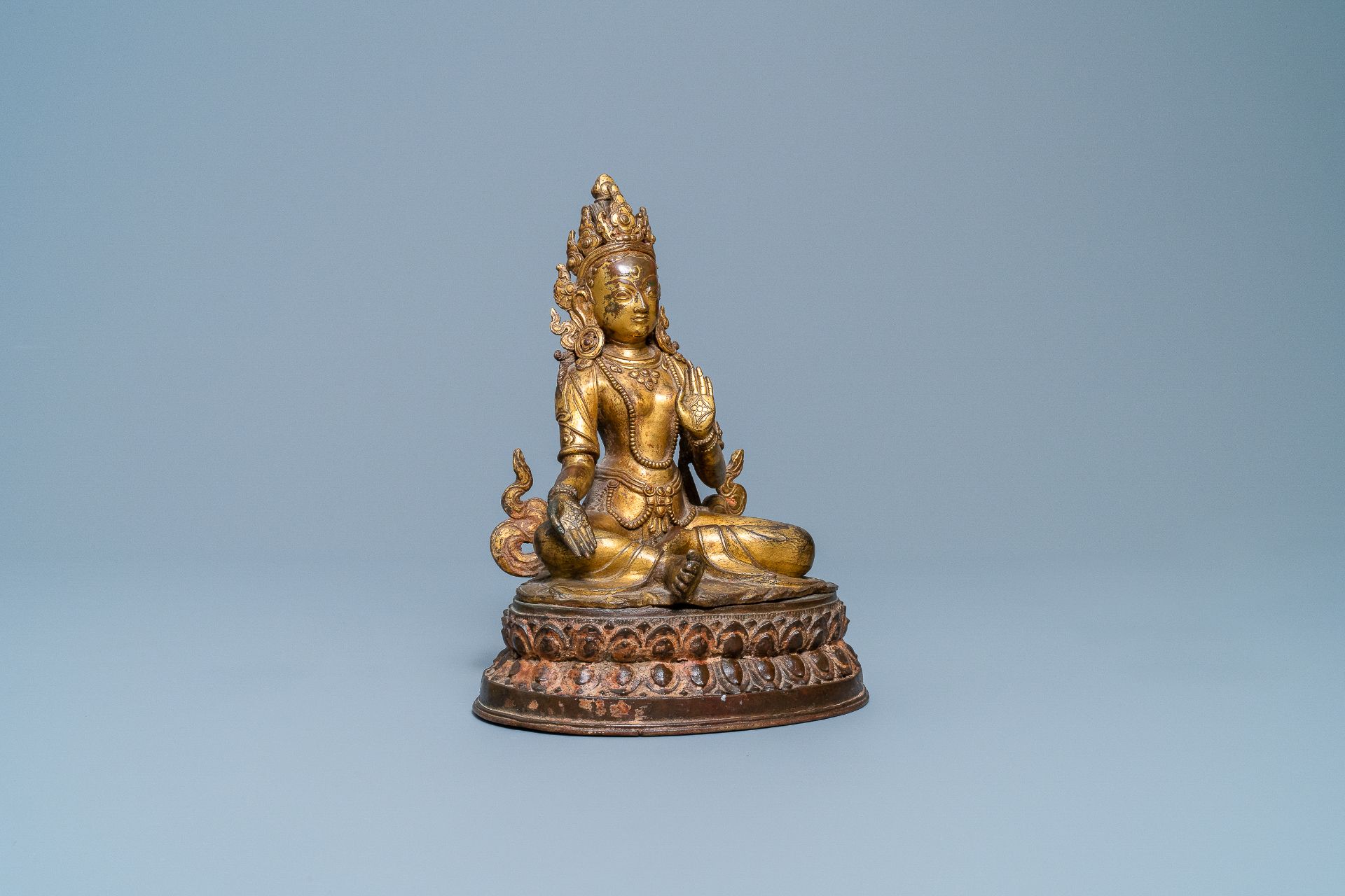 A Nepalese gilt bronze figure of White Tara, 16th C.