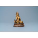 A Nepalese gilt bronze figure of White Tara, 16th C.