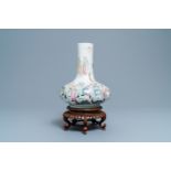 A fine Chinese famille rose bottle vase with immortals, Qianlong mark, Republic