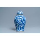 A Chinese blue and white 'butterfly' vase and cover, 19th C.