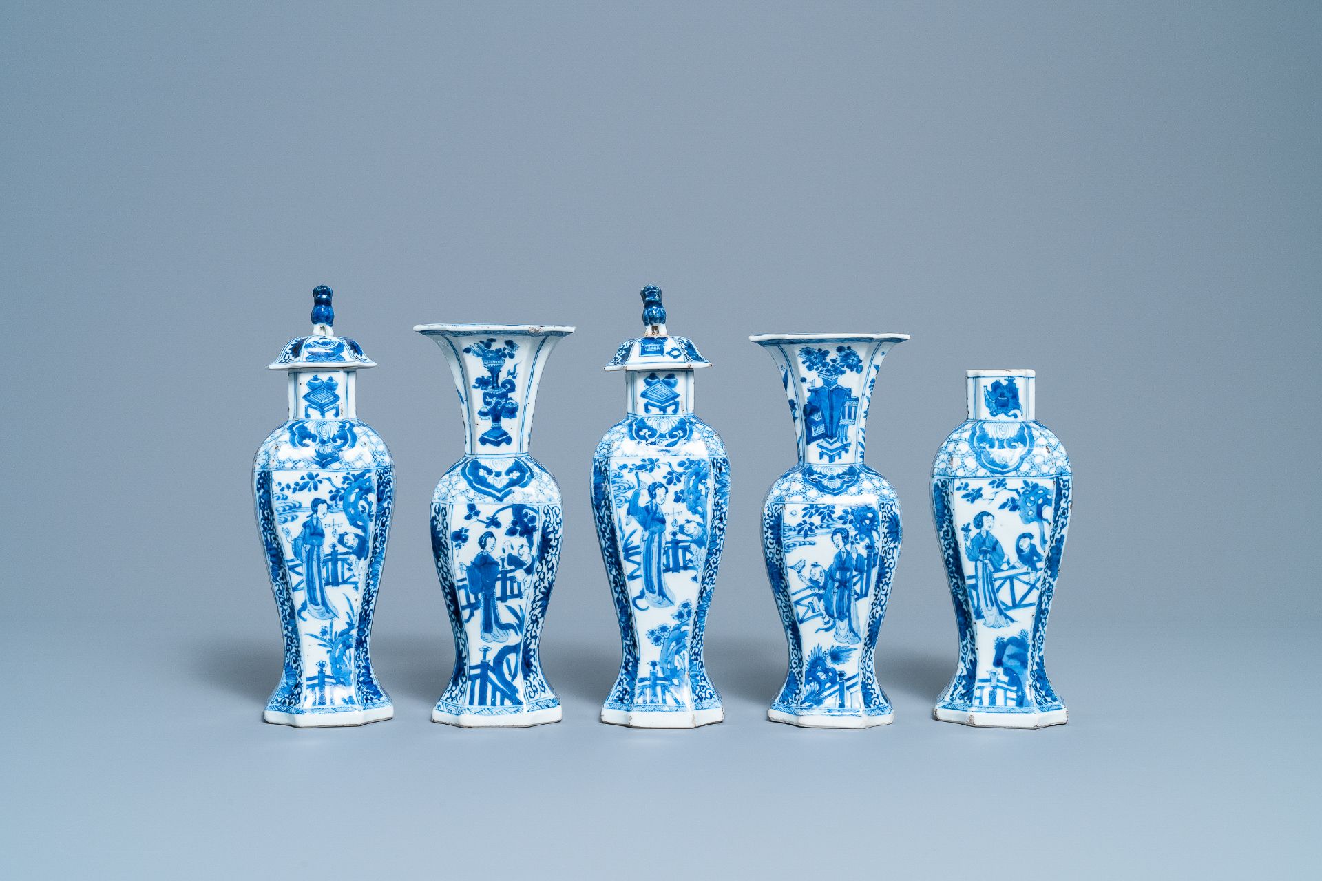 A Chinese blue and white five-piece garniture with boys and ladies, Kangxi