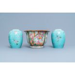 A Chinese Canton famille rose jardiniere and a pair of turquoise-ground jars, 19th C.
