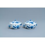 A pair of Chinese blue and white 'antiquities' bowls and covers, Kangxi