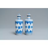 A pair of Chinese blue and white vases and covers, Kangxi