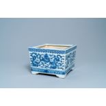 A square Chinese blue and white 'dragon' jardiniere, 19th C.