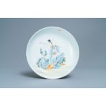 A Chinese famille rose dish with a lady in a landscape, Yongzheng