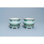 A pair of Chinese famille rose jardinieres on stands, Qianlong mark, Jiaqing