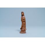 A Chinese carved wooden figure of Guanyin, 18/19th C.