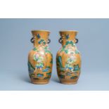 A pair of Chinese Nanking crackle-glazed vases with moulded design of Li Tieguai, 19th C.