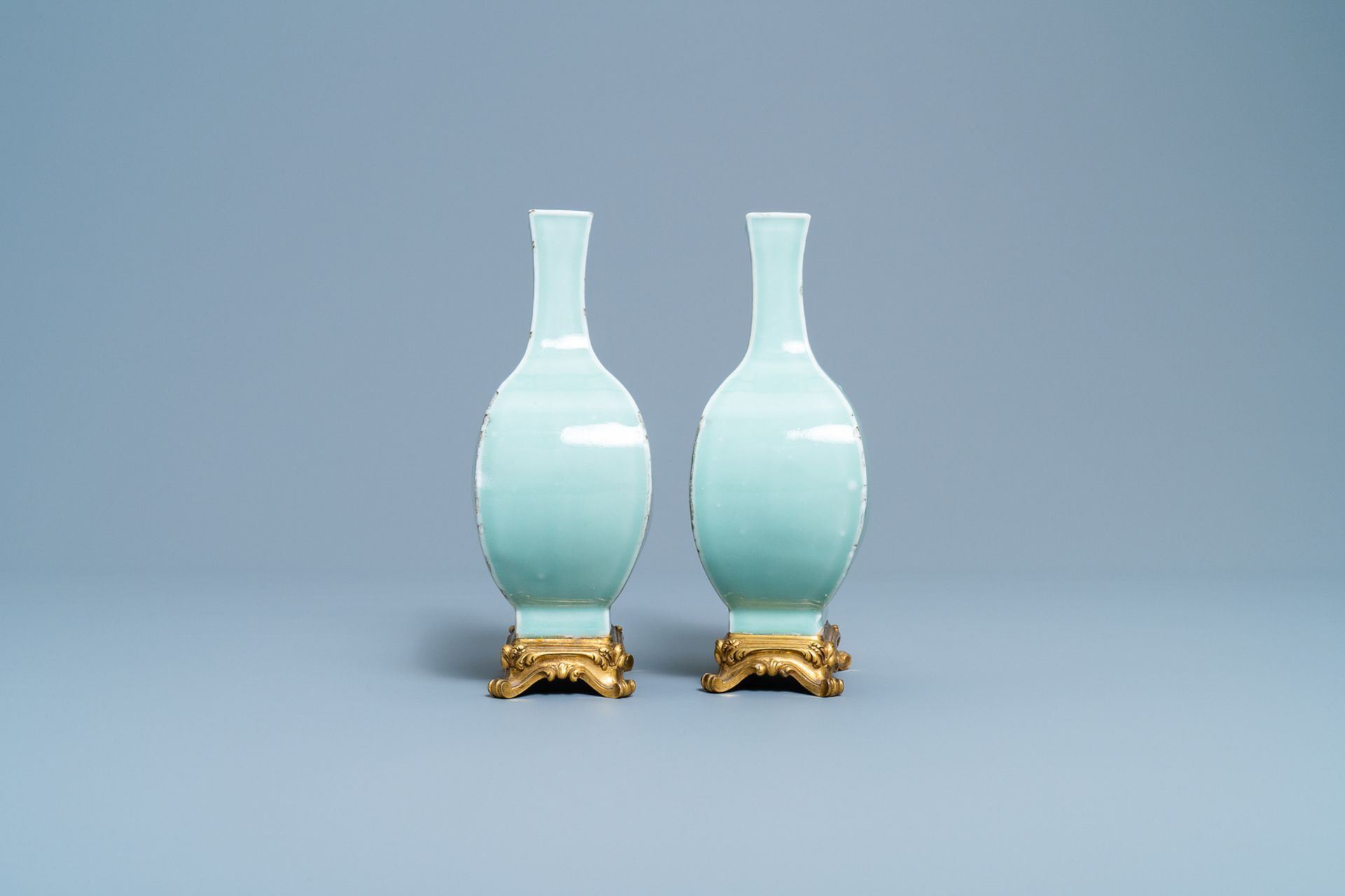 A pair of Chinese monochrome celadon vases with gilt bronze mounts, 18/19th C. - Image 3 of 7