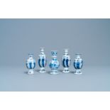 Four Chinese blue and white miniature vases and a huqqa base, Kangxi