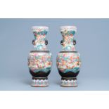 A pair of Chinese Nanking famille rose crackle-glazed 'warrior' vases, 19th C.