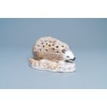 A polychrome faience flower holder shaped as a hedgehog, Northern France, 18/19th C.