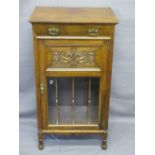 EDWARDIAN CARVED MAHOGANY MUSIC CABINET with single frieze drawer over a carved panel and glazed