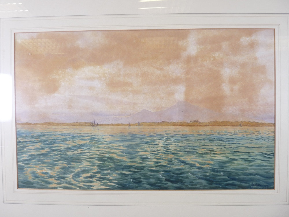J AITKEN watercolour - seascape with sailing boats and mountains to the background, signed and dated
