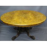 VICTORIAN BURR WALNUT BREAKFAST TABLE, the oval top having string and leaf swag inlay on a four