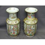 19TH CENTURY CANTON FAMILLE ROSE DECORATED VASES, a pair, with dragon and hoho bird framed panels of