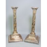SHEFFIELD PLATED CANDLESTICKS, a pair, vine covered Corinthian cap columns on urn and leaf decorated