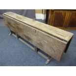 LATE VICTORIAN PITCH PINE WAKE TYPE TABLE, heavy gauge twin-flap top, having double central gates,