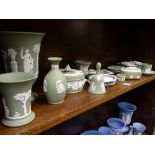 WEDGWOOD GREEN JASPERWARE, 15 pieces, a pair of lidded boxes and a pair of pin trays, similarly