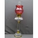 VICTORIAN STYLE OIL LAMP, mixed brass and glass column base with cut glass font and molded cranberry