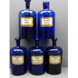 FIVE LARGE BRISTOL BLUE GLASS APOTHECARY BOTTLES bearing mercurial type glass labels, 32cm heights