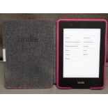 KINDLE - hand held in pink case