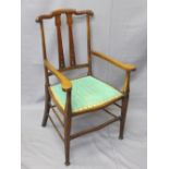 EDWARDIAN MAHOGANY ARMCHAIR having slight Art Nouveau detail and upholstered seat, 97cms H, 58cms