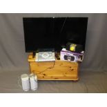 POLAROID FLATSCREEN TV WITH REMOTE on a pine lidded box stand, modern, with a boxed quantity of