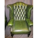 ANTIQUE STYLE BUTTON BACK GREEN LEATHER EFFECT WING BACK ARMCHAIR, 109cms H, 83cms W, 52cms seat D