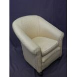 VINTAGE RE-UPHOLSTERED ARMCHAIR on front bun feet and brass castors, 80cms H, 74cms W, 50cms seat