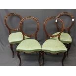 SET OF FOUR VICTORIAN MAHOGANY BALLOON BACK SALON CHAIRS with carved floral top rail detail and