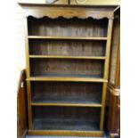 REPRODUCTION OAK OPEN BOOKCASE with shaped top frieze, 197cms H, 132cms max W, 32cms D