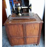 WOODEN CASED SEWING MACHINE, together with a small shelved cabinet