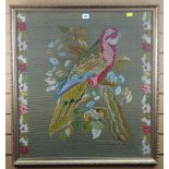 BERLIN-WORK PANEL DEPICTING A PARROT flanked by chains of flowers, 77 x 71cms (including frame)