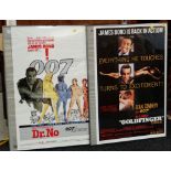 TWO JAMES BOND 007 REPRODUCTION POSTERS in frames 'Dr. No' and 'Goldfinger'