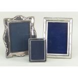 THREE SILVER PORTRAIT PHOTOGRAPH FRAMES, one small, two medium (3)