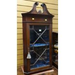 ANTIQUE MAHOGANY HANGING CORNER CABINET with single astragal glazed door