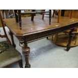 UNUSUAL CARVED OAK VINTAGE DINING TABLE having carved lion head corners with brass rings