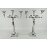 PAIR OF SILVER THREE BRANCH CANDELABRA of Classical form with Corinthian columns and scrolling