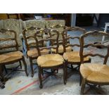 SET OF SIX CONTINENTAL CARVED RUSH SEATED DINING CHAIRS