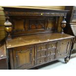 GOOD VINTAGE CARVED OAK SIDEBOARD on fluted bulbous supports, flanking cupbopards, one with